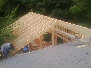 Framing a new roof addition that ties into an existing shingle roof in Sterrett